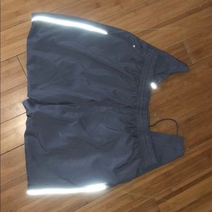Wind pants and jacket with reflective trim on legs